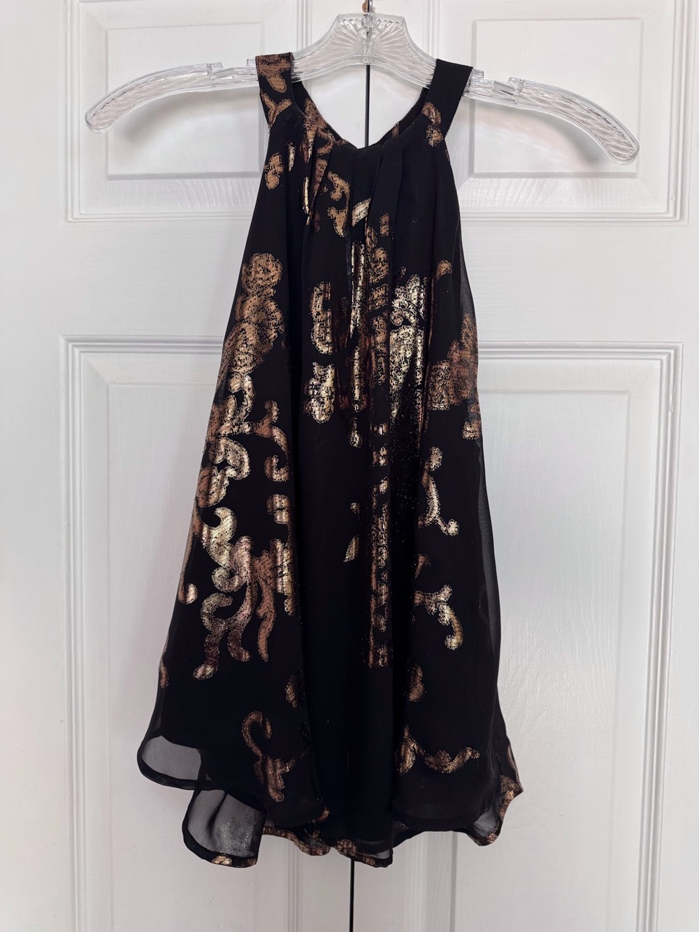 Black with shiny gold lame’ dressy halter top. Size Large.